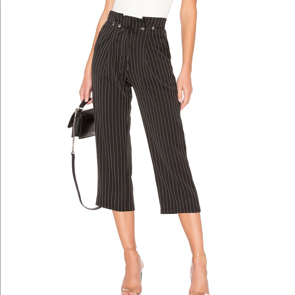 About Us: Chloe Pleated Pant in Black Pinstripe